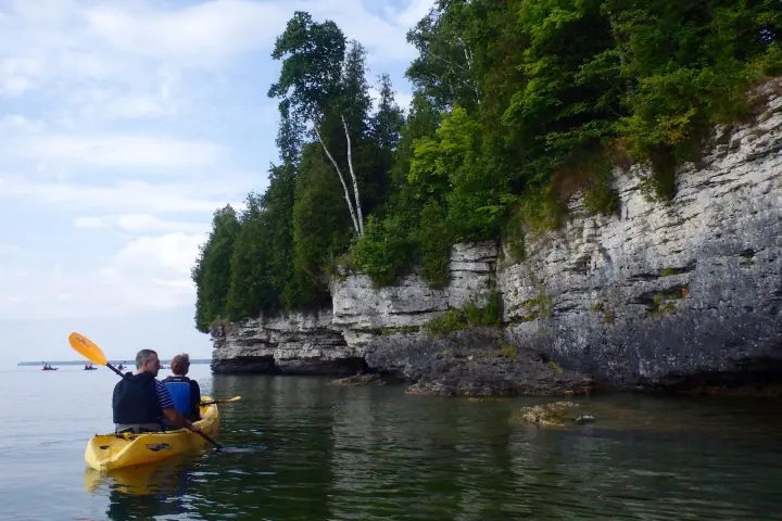 A couple kayaks on the cave point kayak tour
