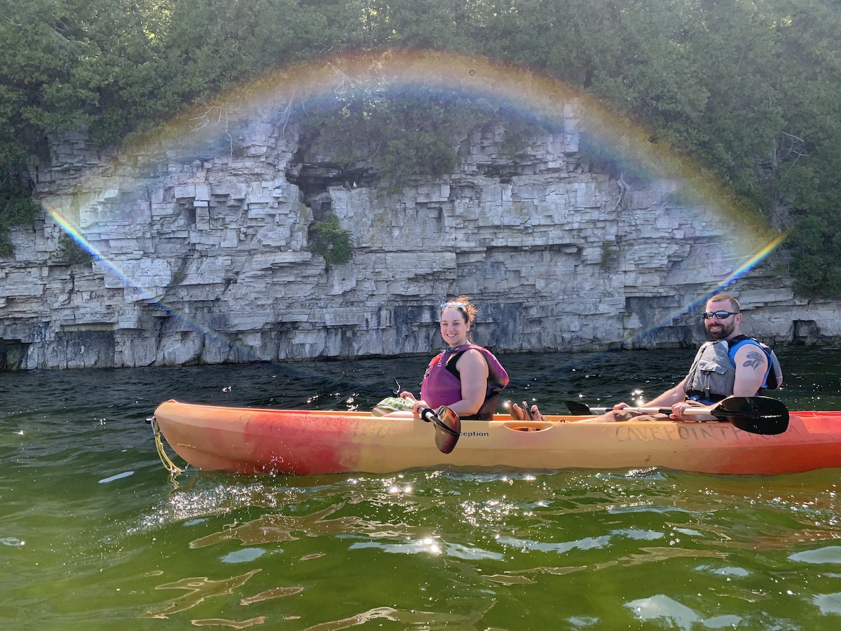 a young girl riding a wave on a surfboard in the water