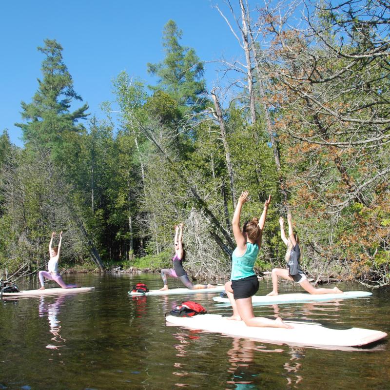 group doing SUP yoga