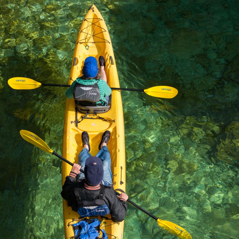 Kayakers paddling a tandem kayak in Door County, WI