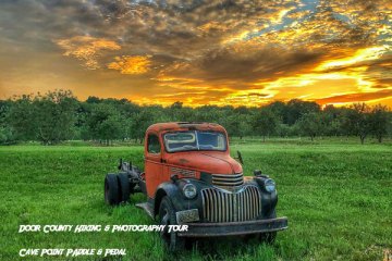 Photo of old pickup truck in a field from the Door County Hiking and Photography Tour