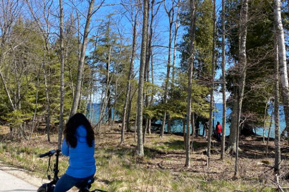 a person riding a motorcycle on the side of a road