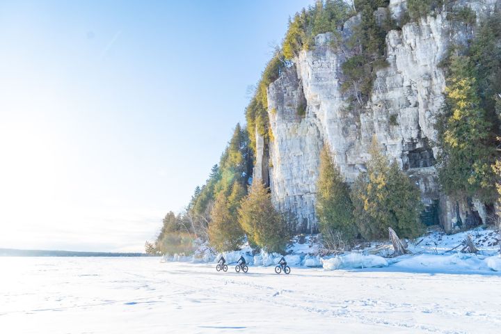 a group of people walking in the snow