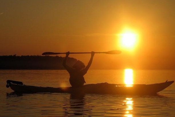 a sunset over a body of water